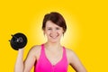 Sporty fit healthy smiling beautiful woman, red head girl holding a dumbbell Royalty Free Stock Photo