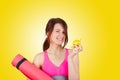 Sporty fit healthy smiling beautiful woman, red head girl holding an yoga mat Royalty Free Stock Photo