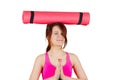 Sporty fit healthy smiling beautiful woman, red head girl holding an yoga mat Royalty Free Stock Photo