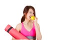 Sporty fit healthy smiling beautiful woman, red head girl holding an yoga mat Royalty Free Stock Photo