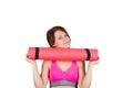 Sporty fit healthy smiling beautiful woman, red head girl holds an apple and yoga mat. Royalty Free Stock Photo