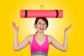 Sporty fit healthy smiling beautiful woman, red head girl holds an yoga mat Royalty Free Stock Photo