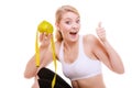 Sporty fit woman with measure tape fruit. Time for diet slimming. Royalty Free Stock Photo