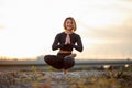 Sporty fit woman practicing yoga, doing Ardha Padmasana exercise on one leg Royalty Free Stock Photo