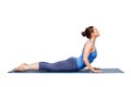 Sporty fit yogini woman practices yoga asana bhujangasana Royalty Free Stock Photo