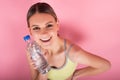 SPORTY FITNESS GIRL HOLDING BOTTLE OF WATER Royalty Free Stock Photo