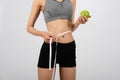 Sporty fitness woman in sportswear with measuring waist with tape. healthy sport lifestyle Royalty Free Stock Photo