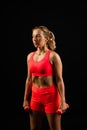 Sporty girl doing exercise with dumbbells, silhouette studio shot over dark and whitebackground Royalty Free Stock Photo