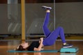 Sporty girl doing exercise on platform for an aerobics step Royalty Free Stock Photo