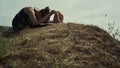 Sporty girl doing gymnastics on beach hill. Woman making yoga asana outdoors. Royalty Free Stock Photo