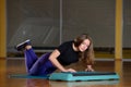 Sporty girl doing push-ups on platform for an aerobics step Royalty Free Stock Photo