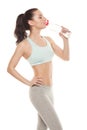 Sporty girl drinking water from a bottle after a workout, fitness Royalty Free Stock Photo