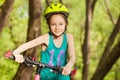 Sporty girl driving her mountain bike by handlebar Royalty Free Stock Photo