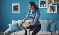 Sporty girl on exercise bike