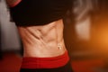 Sporty girl in gym show abs. woman in tonus Royalty Free Stock Photo