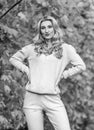 Sporty girl. Girl relaxing in nature wearing knitwear suit. Clothes for rest. Feel practicality and comfort. Model