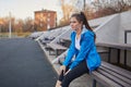 Sporty girl on the stadium. Stadium tribune. Slim sporty fitness woman. Royalty Free Stock Photo