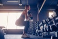 Sporty girl workout with dumbbell in gym Royalty Free Stock Photo