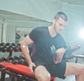 Sporty guy sitting on bench Royalty Free Stock Photo