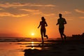 Sporty and healthy lifestyle, friends jogging at sunrise on summer beach. Silhouette of couple pair running on sunny beach. couple