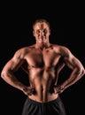 Sporty and healthy muscular strong man isolated on black background Royalty Free Stock Photo