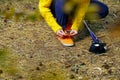 Sporty hiking woman tying shoelaces on her jogging shoes while taking a break after hiking in autumn forest. hiking concept, Royalty Free Stock Photo