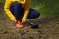 Sporty hiking woman tying shoelaces on her jogging shoes while taking a break after hiking in autumn forest. hiking concept, Royalty Free Stock Photo