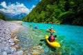 Sporty kayakers on the beautiful turquoise Soca river, Bovec, Slovenia Royalty Free Stock Photo