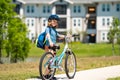 Sporty kid riding bike on a park. Child in safety helmet riding bicycle. Kid learns to ride a bike. Kids on bicycle Royalty Free Stock Photo