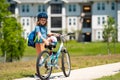 Sporty kid riding bike on a park. Child in safety helmet riding bicycle. Kid learns to ride a bike. Kids on bicycle Royalty Free Stock Photo