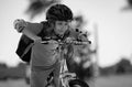 Sporty kid riding bike on a park. Child in safety helmet riding bicycle. Kid learns to ride a bike. Kids on bicycle Royalty Free Stock Photo