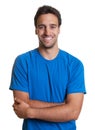 Sporty latin guy with crossed arms in a blue shirt Royalty Free Stock Photo