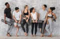 Sporty Lifestyle. Group of multiracial people resting with yoga mats before training