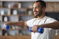 Sporty Lifestyle. Smiling Young Black Male Training With Dumbbells At Home Royalty Free Stock Photo