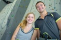 Sporty male and female posing at climbing wall Royalty Free Stock Photo