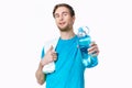 sporty man in blue t-shirt water bottle towels workout Royalty Free Stock Photo