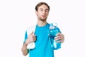 sporty man in blue t-shirt water bottle towels workout Royalty Free Stock Photo