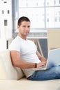 Sporty man browsing internet at home Royalty Free Stock Photo