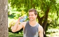 Sporty man drinking water in the park Royalty Free Stock Photo