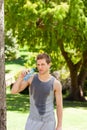 Sporty man drinking water in the park Royalty Free Stock Photo