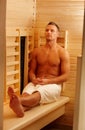 Sporty man enjoying sauna Royalty Free Stock Photo
