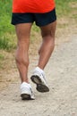 Sporty man jogging on a path