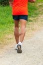 Sporty man jogging on a path