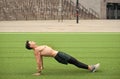 Sporty Man Making back Plank Exercise. guy in reverse plank exercise. Yoga fitness man stretching body in upward plank