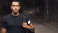 Sporty Man Posing After Workout, Wearing Black T-Shirt