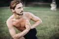 Sporty man practicing yoga outdoor