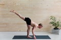 Sporty man practicing yoga, warrior pose Royalty Free Stock Photo