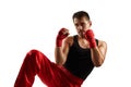 Sporty man in red sports bandages on his hands fighting