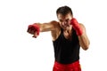 Sporty man in red sports bandages on his hands fighting