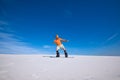 Sporty man rides on the snowboard in the sand dunes Royalty Free Stock Photo